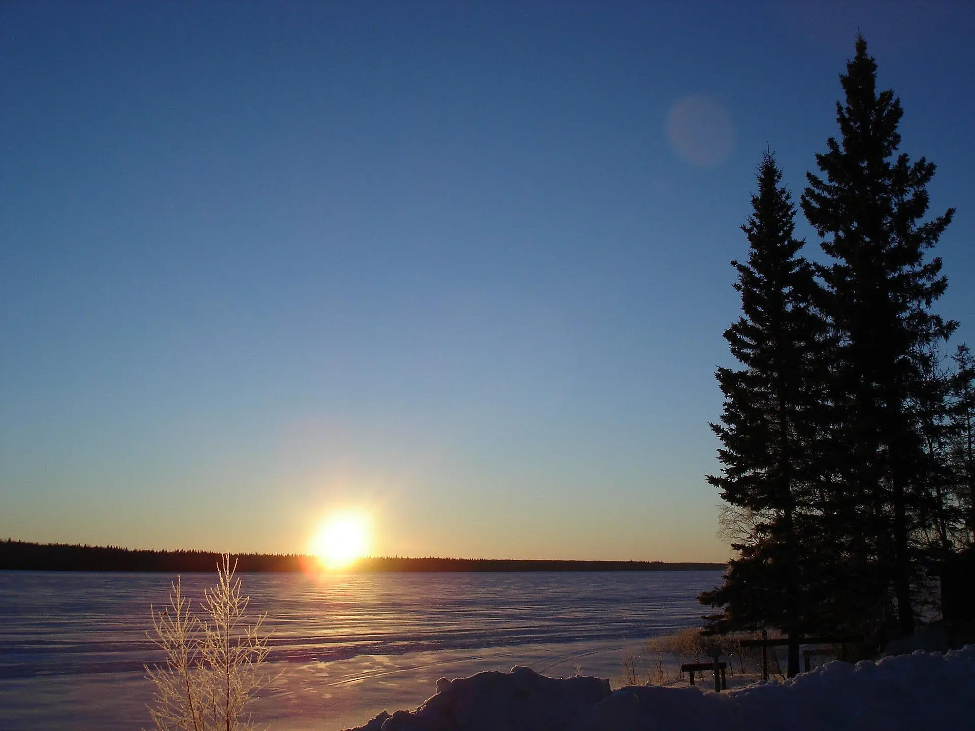 Winter sunrise over frozen Christopher Lake