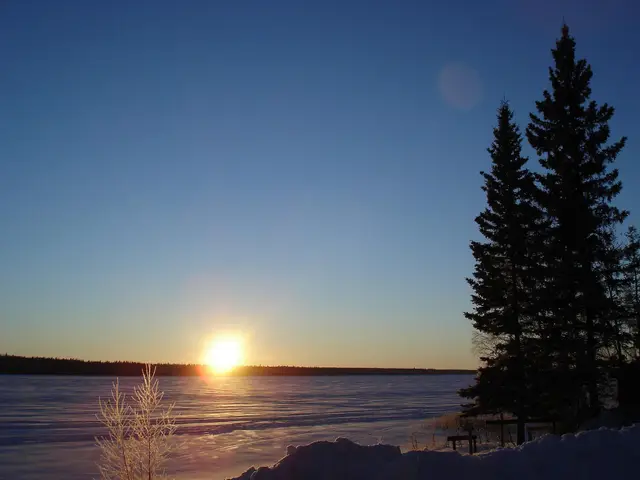 Winter sunrise over frozen Christopher Lake