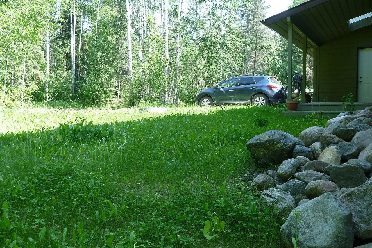 Cabin and car in the boreal woods, 2013